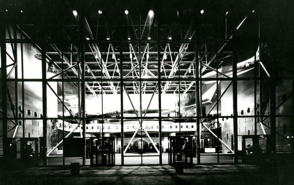 Black and white photograph of the National Air and Space Museum at night with the Apollo 11 Lunar Module