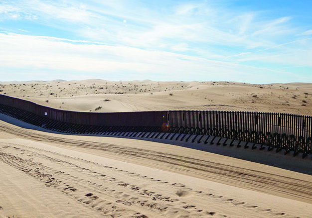 The border wall in the Imperial Sand Dunes, 20 miles west of Yuma, AZ, on February 25, 2019. Due to the constantly shifting contour of the sand dunes, the border wall “floats” on top of the sand and can be lifted and resettled as necessary.   U.S. Customs and Border Protection photo by Jerry Glaser